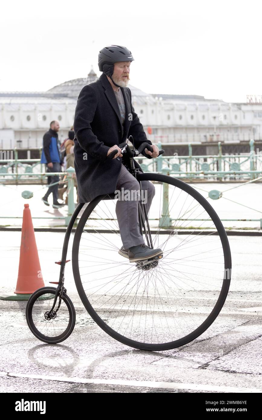 Kings Road, Brighton, City of Brighton & Hove, East Sussex, UK. Penny-farthing riders lead off on this years Brighton Half Marathon under a cloudy sky and low temperature along Brighton & Hove seafront. 25th February 2024. David Smith/Alamy Live News Stock Photo