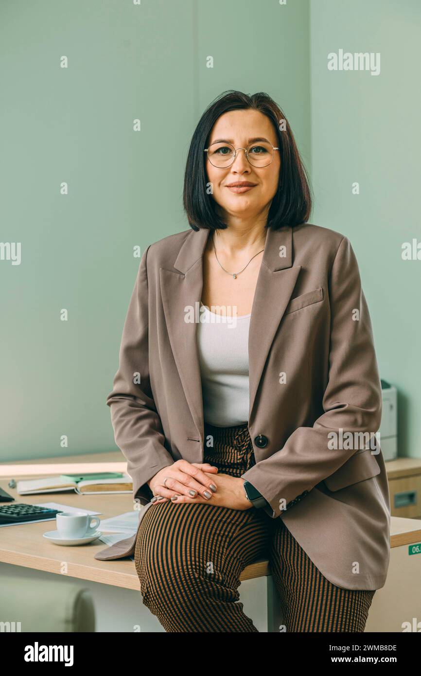 Woman leans over study hi-res stock photography and images - Alamy