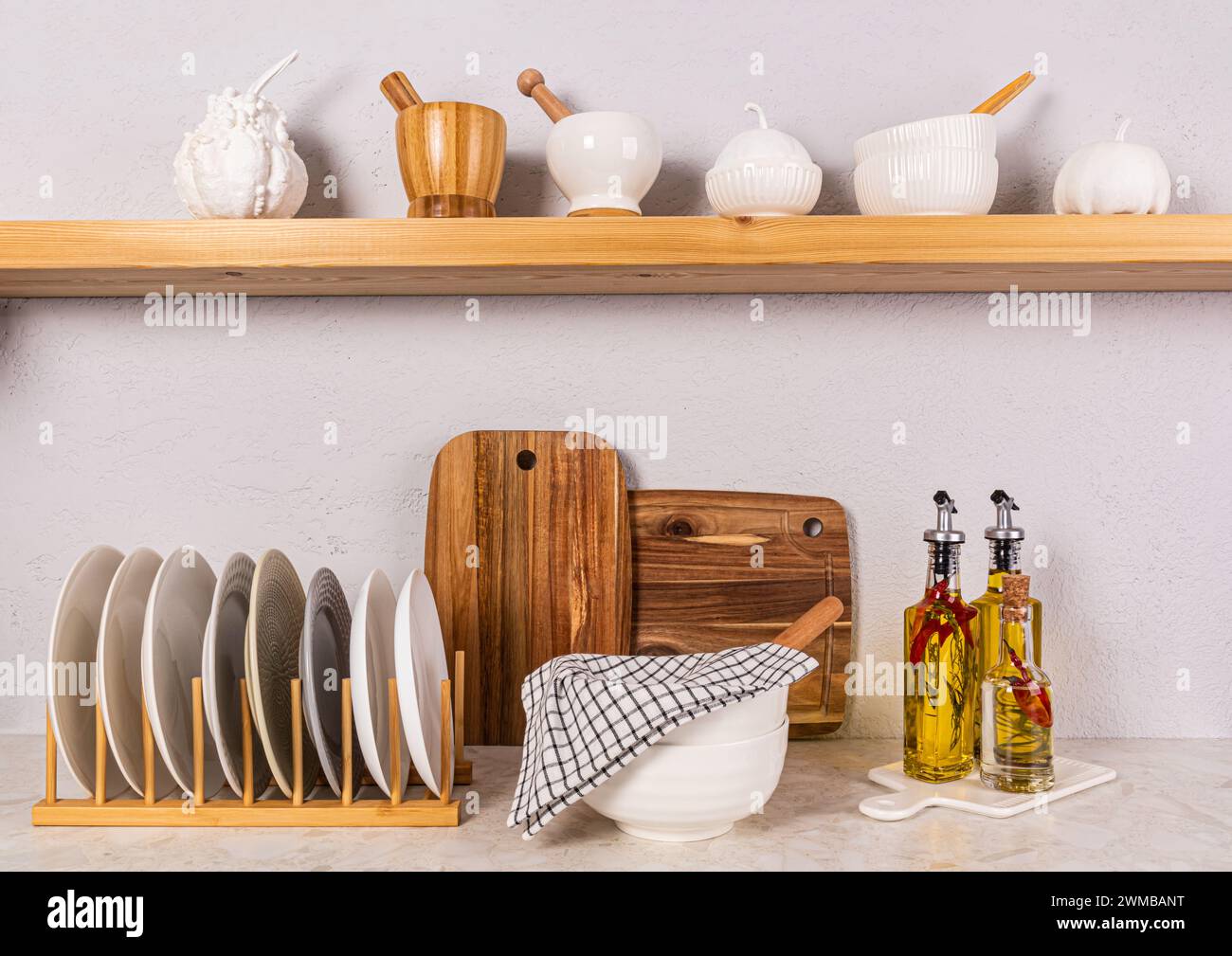 Bright kitchen space in a modern kitchen. Towels, a set plate stand of ...