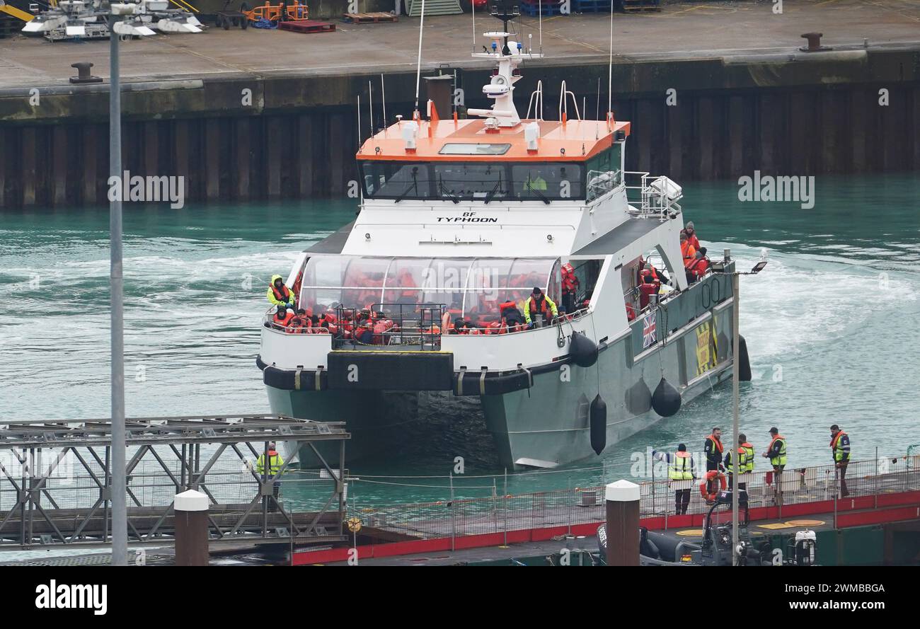 A group of people thought to be migrants are brought in to Dover, Kent, onboard a Border Force vessel following a small boat incident in the Channel. Picture date: Sunday February 25, 2024. Stock Photo