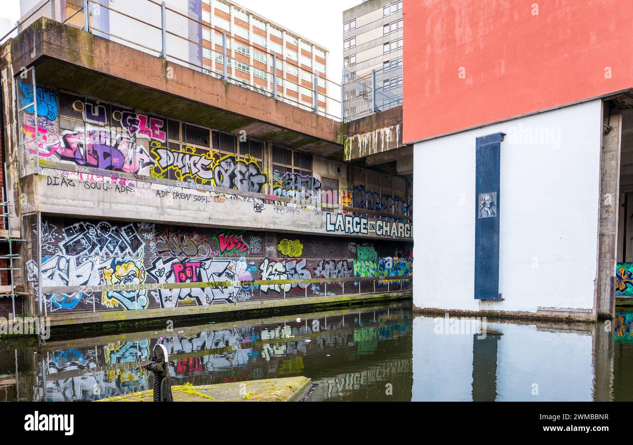 Graffiti and spray can paint artwork along the Fazeley canal in the