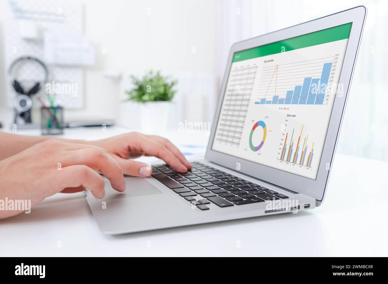 Man working with spreadsheet on laptop. Business analytics. Stock Photo