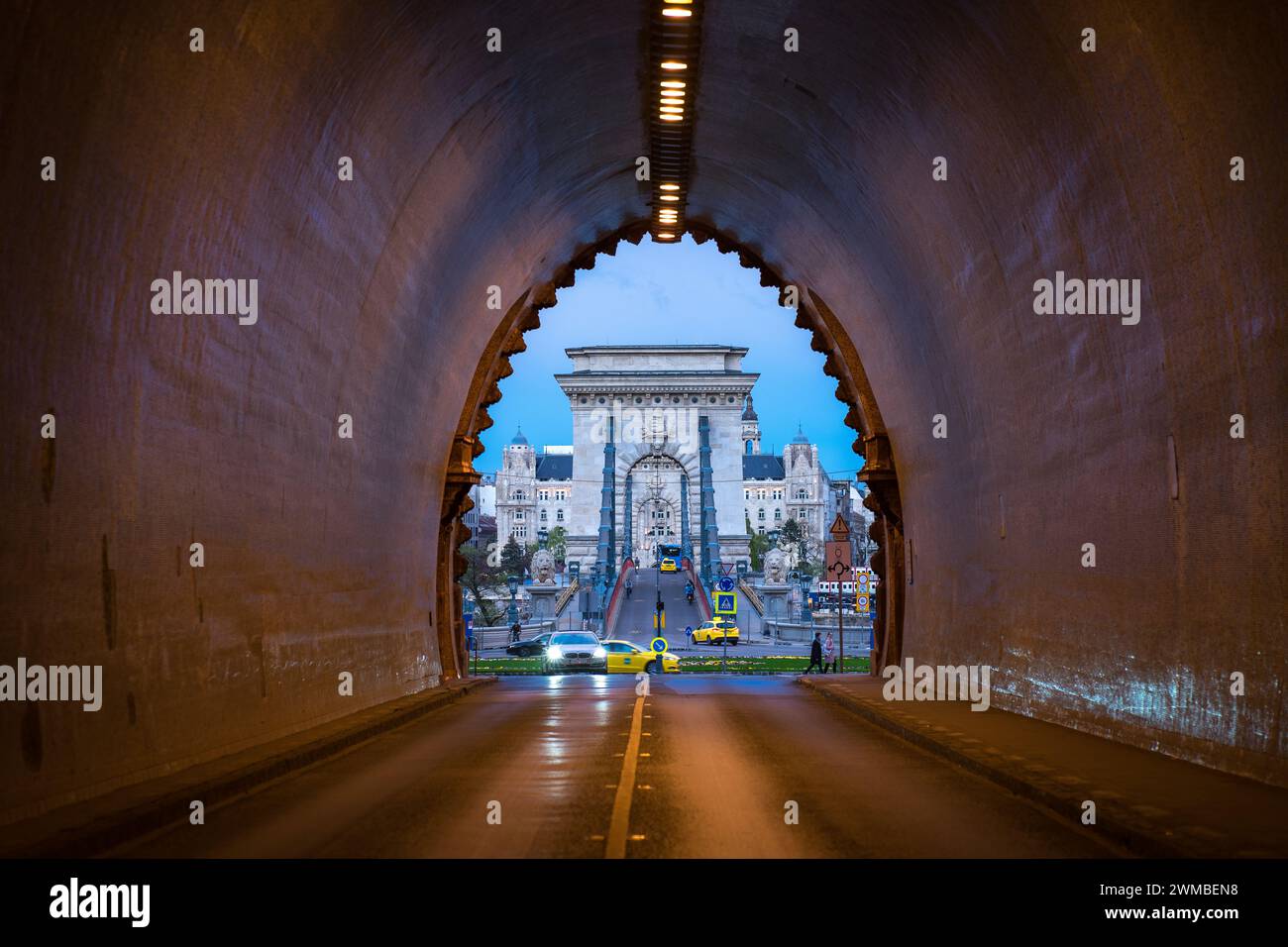 Budapest, Hungary - Apr 16 2023: Buda Castle Tunnel with the famous Chain bridge in the background; Budapest wallpaper Stock Photo