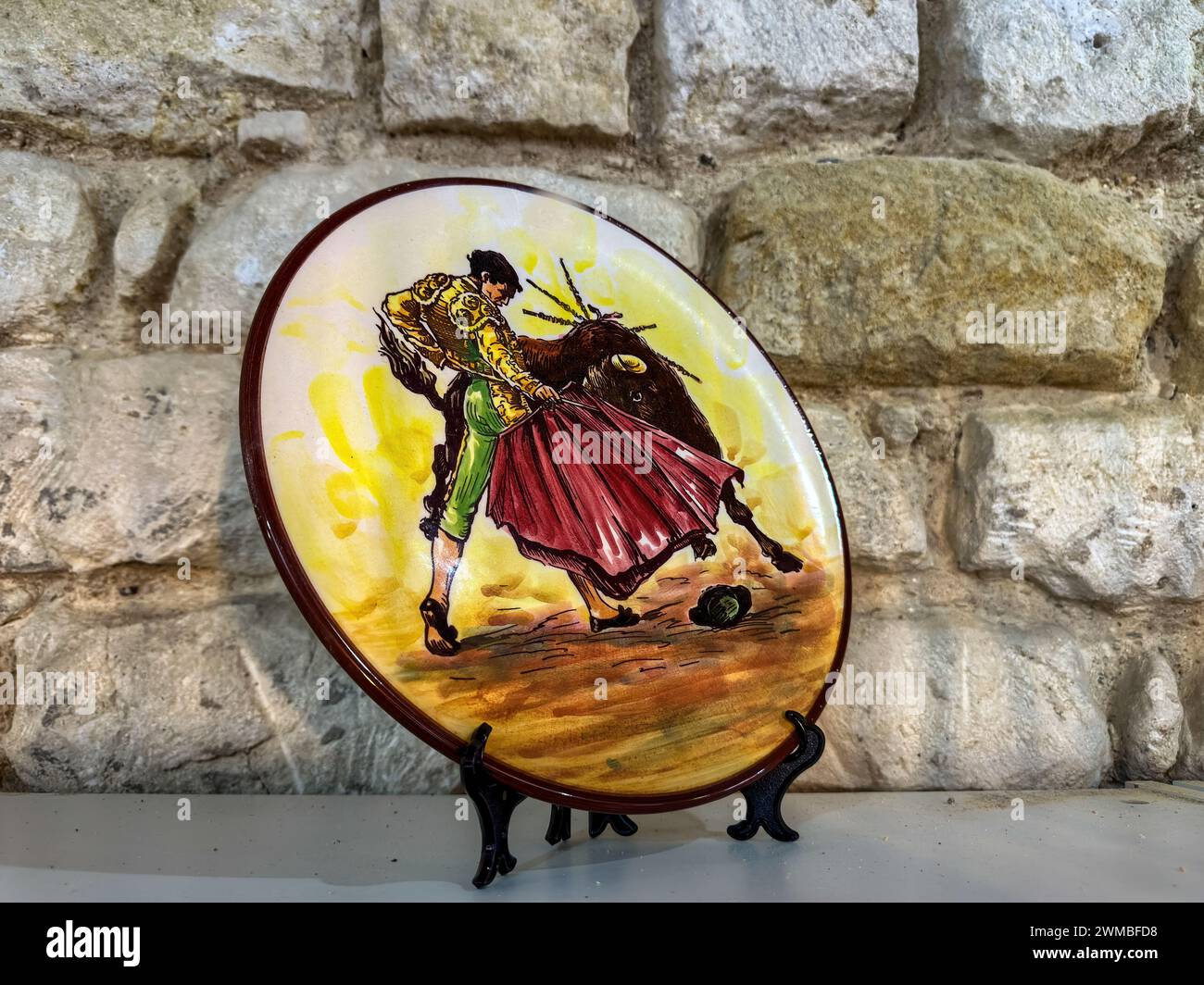 Souvenir plate with image of a bullfighter, Alicante, Spain Stock Photo