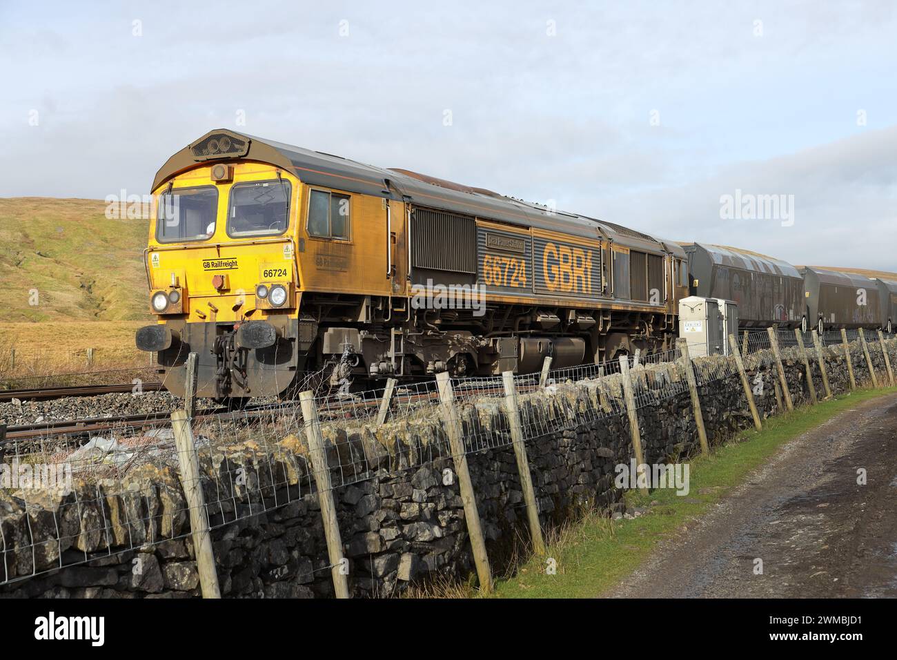 Freight train with a Drax Power Station Badge on the side on the Settle to Carlisle railway at the Bleamoor Sidings near Ribblehead, Yorkshire Dales, Stock Photo