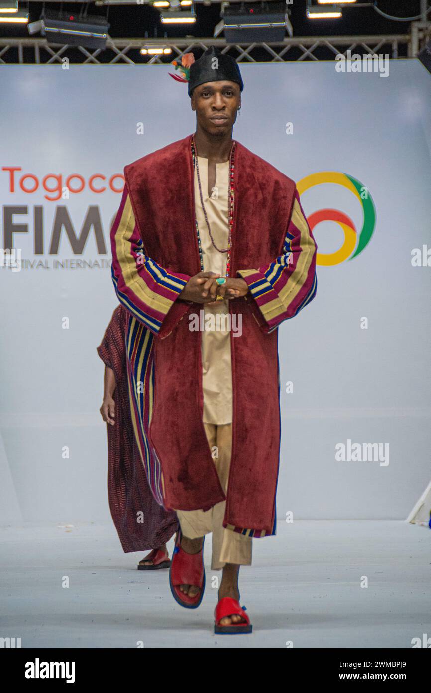 Lome, Togo. 24th Feb, 2024. A model presents a creation of AYO's Haute Couture collections during the 11th Togo international fashion festival FIMO228 in Lome, Togo, Feb. 24, 2024. The 11th Togo international fashion festival FIMO228 was held in Togo's capital Lome from Feb. 21 to 24. Credit: Kpowoenou Yawovi/Xinhua/Alamy Live News Stock Photo