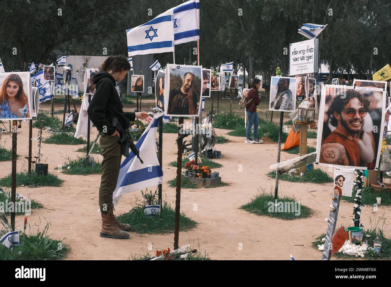 Kibbutz Reim, Israel. 25th Feb, 2024. Visitors join grieving families to pay respect to the victims of the October 7th, 2023, Nova Music Festival Massacre near Kibbutz Reim. 364 festival participants were shot, beaten or burned to death, some following abuse and rape, by infiltrating Palestinian Hamas gunmen from Gaza into Israeli territory. Credit: Nir Alon/Alamy Live News Stock Photo