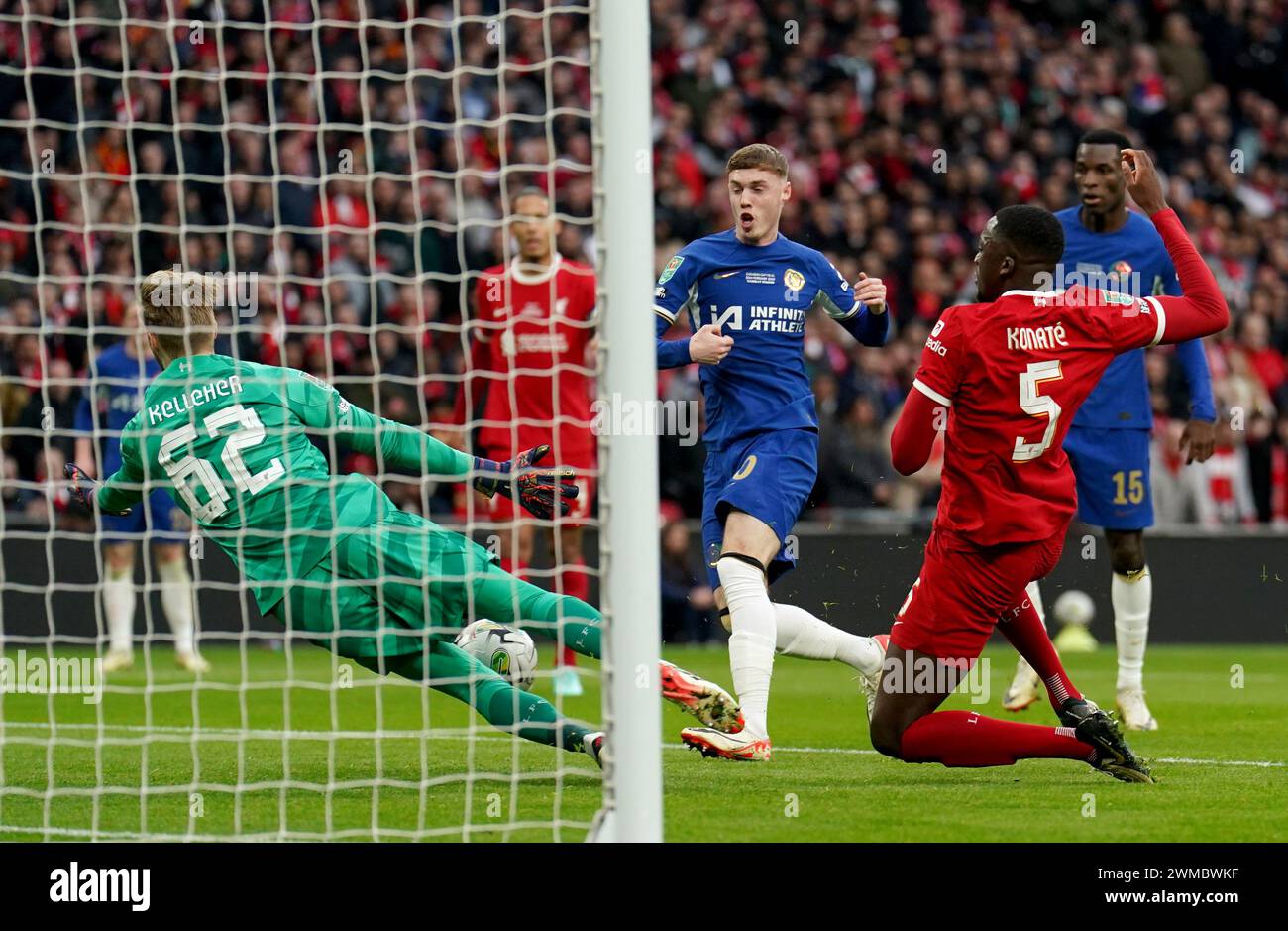 Keleher Liverpool goalkeeper Caoimhin Kelleher (left) saves a shot from Chelsea ...