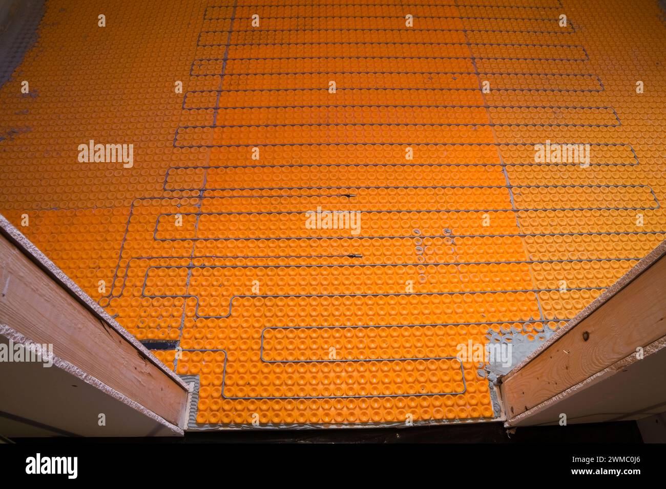 Electric heated floor elements and temperature sensors in unfinished