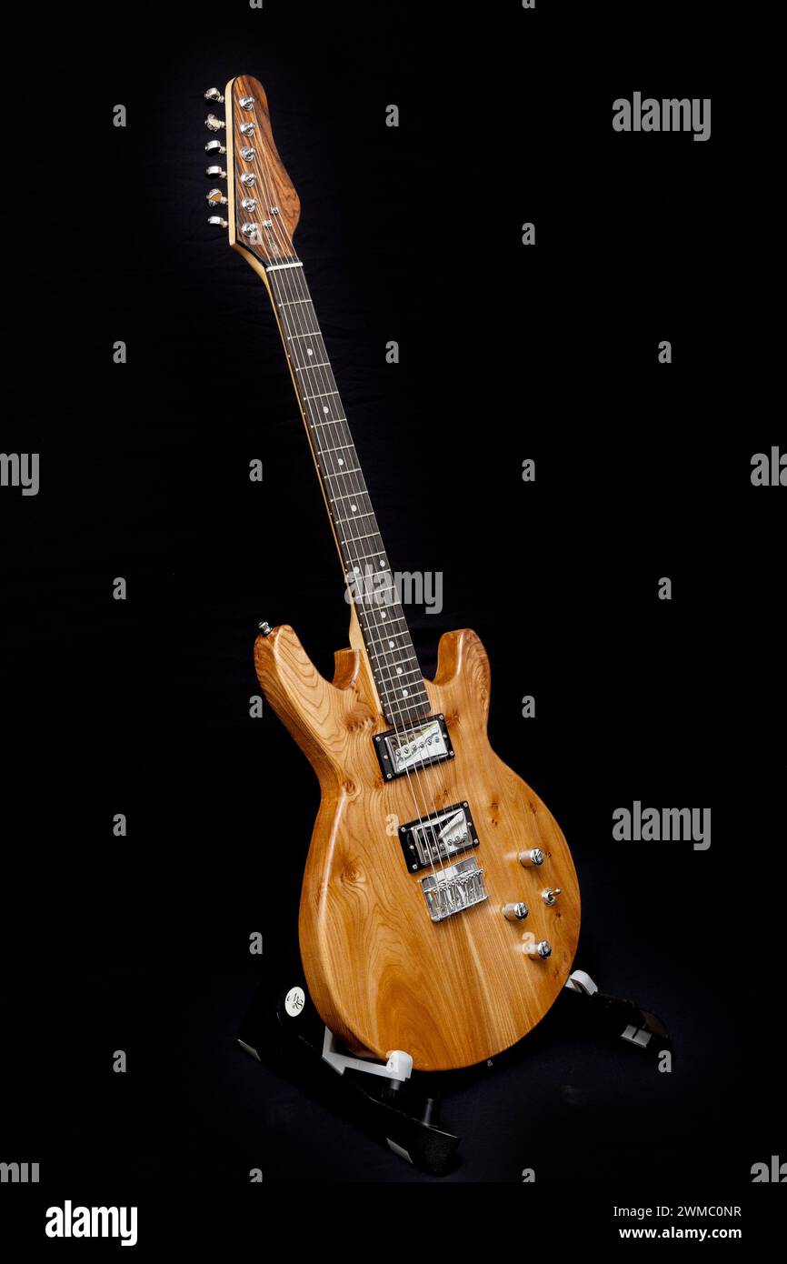 Hand built electric guitar made of elm wood. Hand made guitar. Elm tree