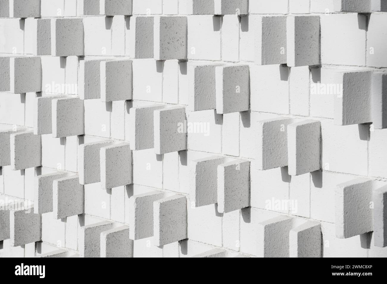 Mid-century modern exterior block wall pattern and texture with shadows Stock Photo