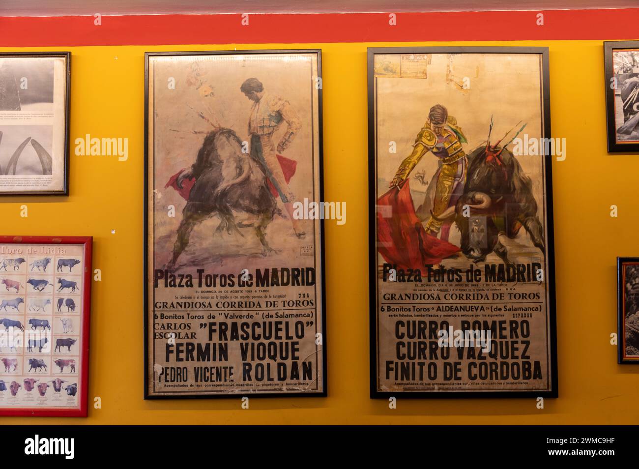 Two wall posters of bullfighting in a bar in the historic city of Cordoba in Andalusia, southern Spain.   Bullfighting is still a tradition, support Stock Photo