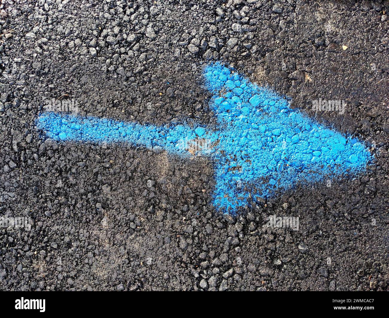 Road paint marking blue arrow hi-res stock photography and images - Alamy
