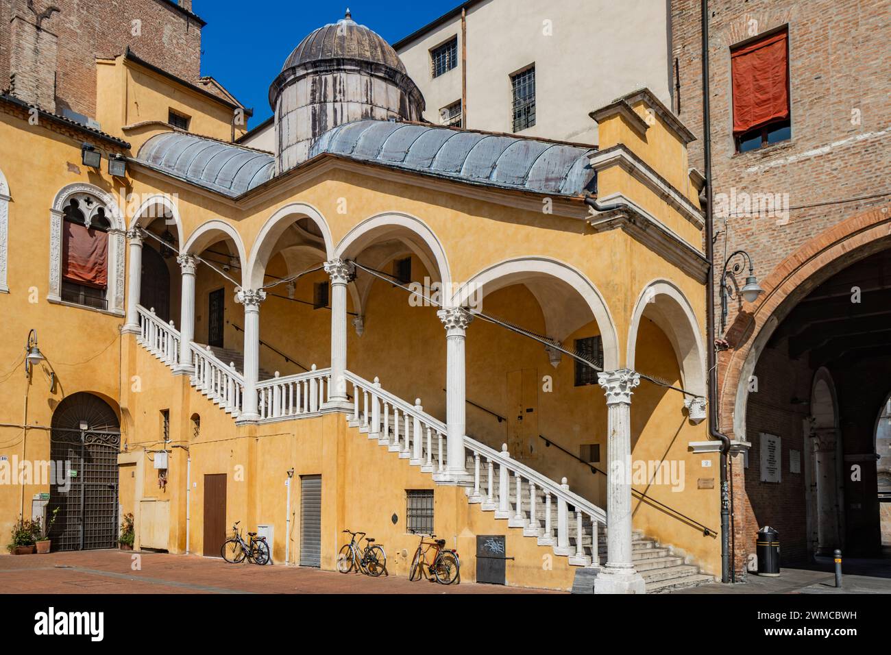June 4, 2023 - Ferrara, Emilia Romagna, Italy. The Municipal Palace, seat of the city municipality. The staircase covered by the porch. UNESCO World H Stock Photo