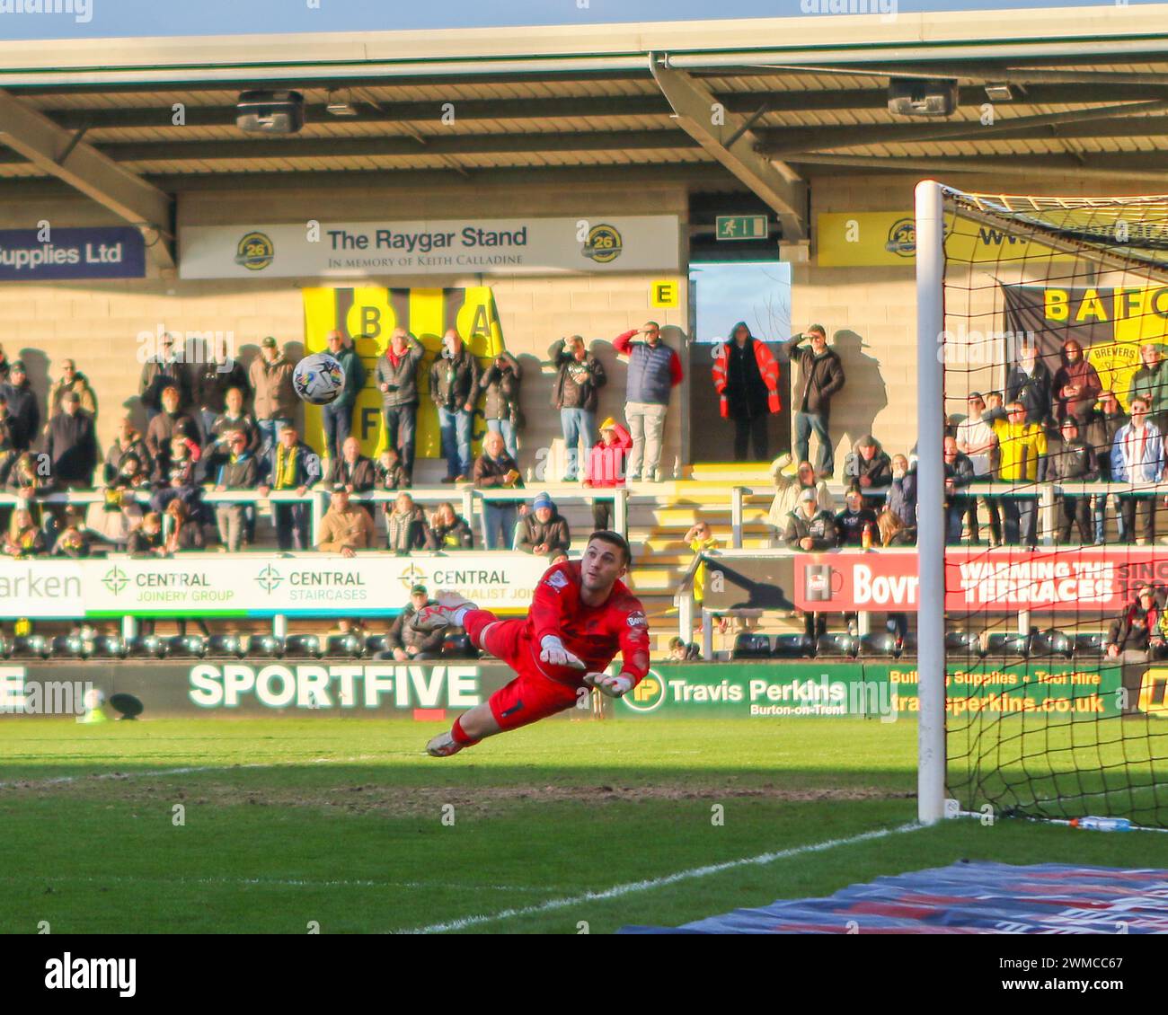 Burton Upon Trent, UK, 24, February, 2024:Burton Albion's goalkeeper Max Crocombe watches as the ball fly's back of the post from a shot from Northampton Town's Shaun McWilliams in the EFL League One Burton Albion v Northampton Town Credit: Clive Stapleton/Alamy Live News Stock Photo