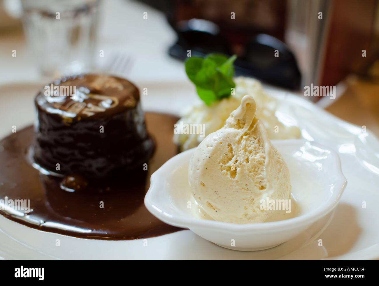 appetizing dessert ice cream and chocolate cake separation by depth of field Stock Photo