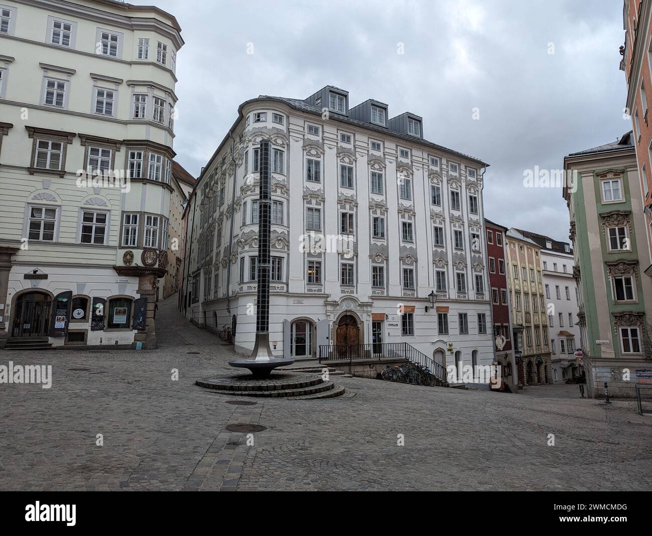 A sculpture seated on a town square's edge in Linz, Austria Stock Photo