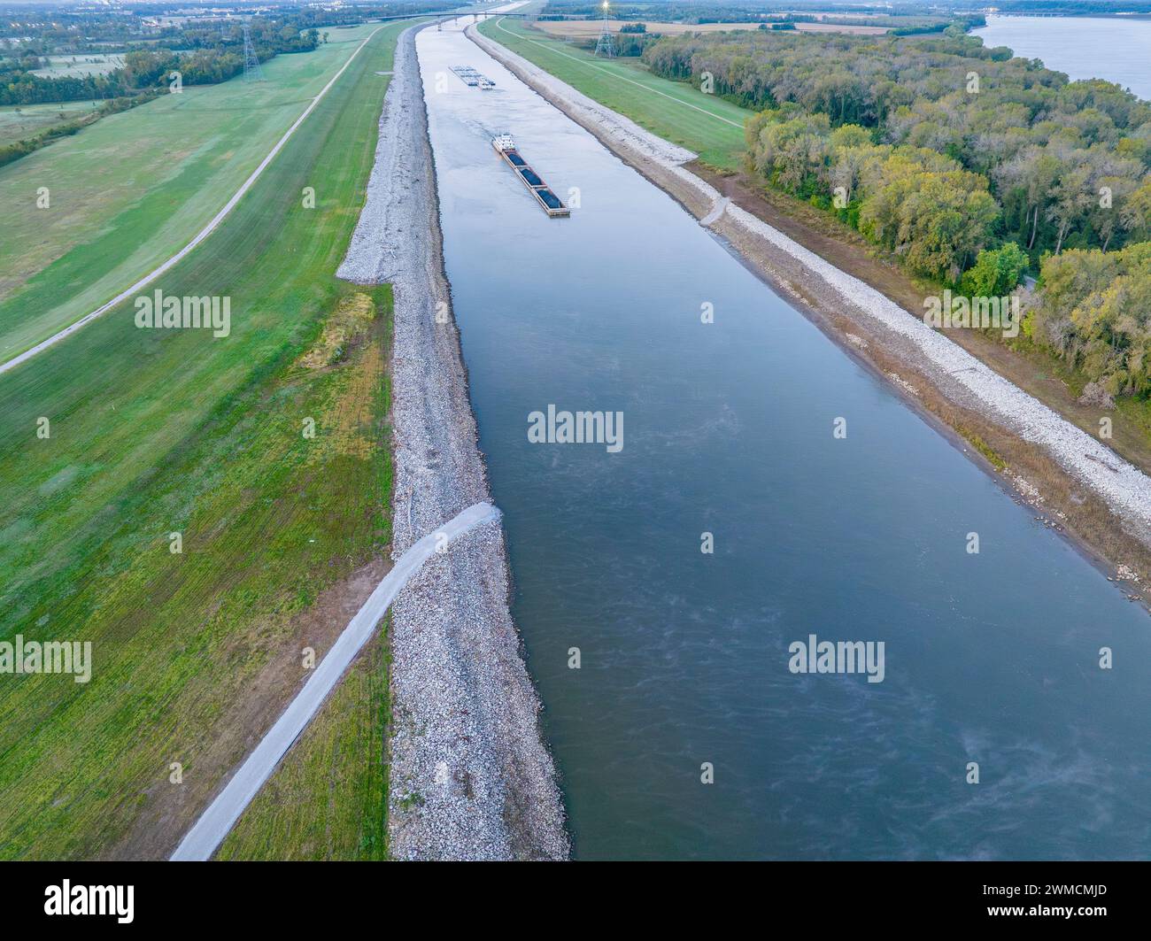 towboats with barges on Chain of Rock Canal of Mississippi River above St Louis, aerial view in October scenery Stock Photo