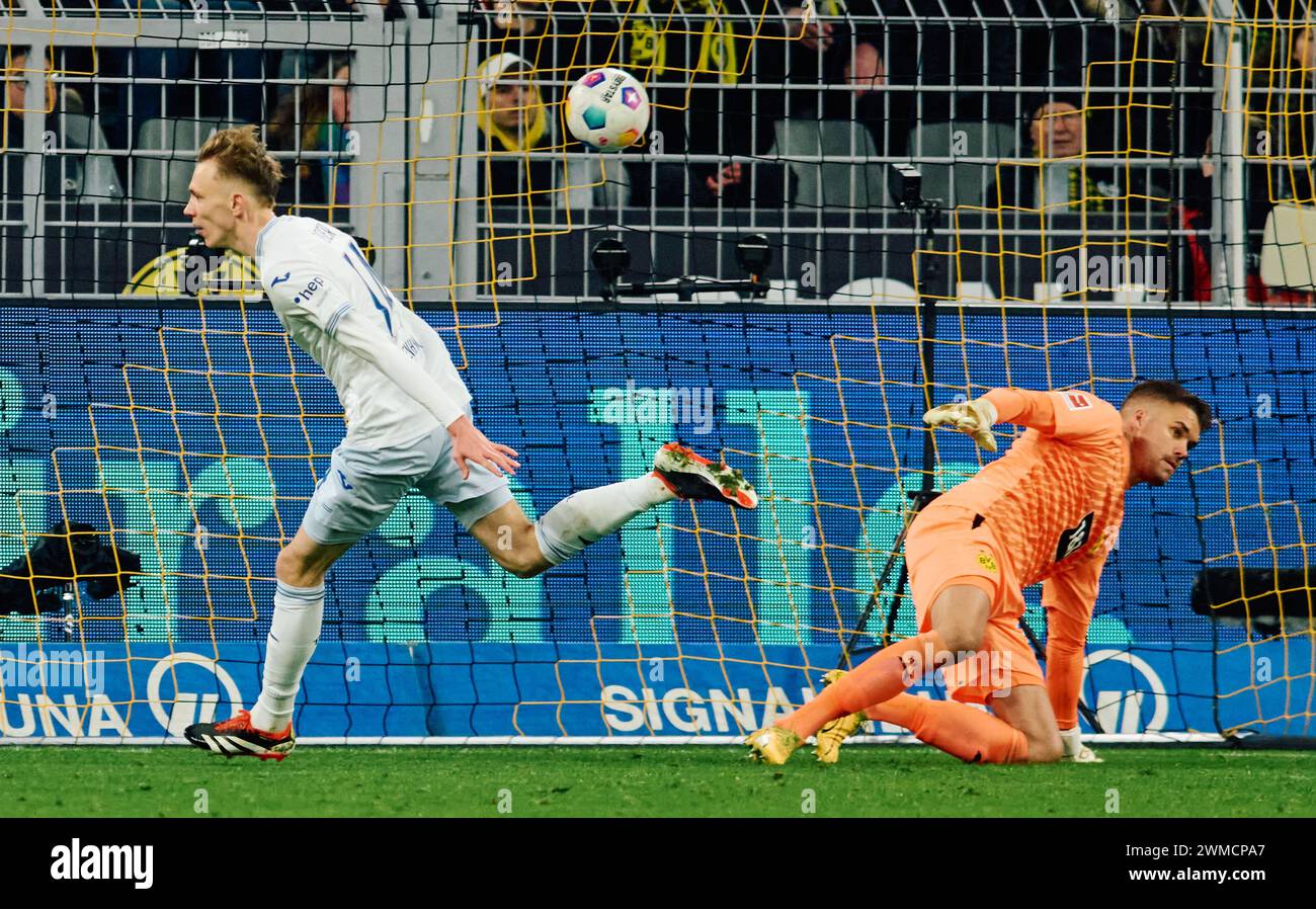 Dortmund, Germany. 25th Feb, 2024. Soccer: Bundesliga, Borussia Dortmund - TSG 1899 Hoffenheim, Matchday 23, Signal Iduna Park. Dortmund goalkeeper Alexander Meyer is unable to prevent Hoffenheim's Maximilian Beier from making it 3-2. Credit: Bernd Thissen/dpa - IMPORTANT NOTE: In accordance with the regulations of the DFL German Football League and the DFB German Football Association, it is prohibited to utilize or have utilized photographs taken in the stadium and/or of the match in the form of sequential images and/or video-like photo series./dpa/Alamy Live News Stock Photo