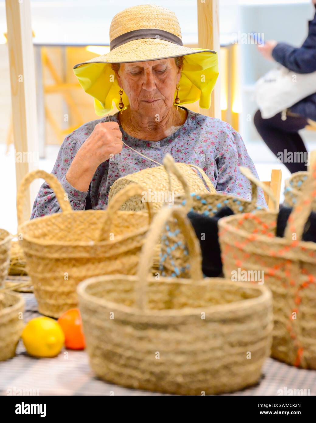 A portrait of a woman basket weaving showing skills in handicrafts from ...
