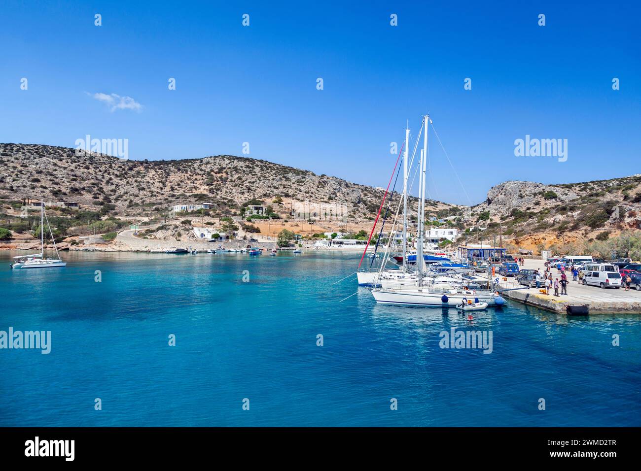 Amazing coastline with clear turquoise water at the port of Schinoussa island, a small island close to Naxos, in Cyclades, Greece, Europe. Stock Photo