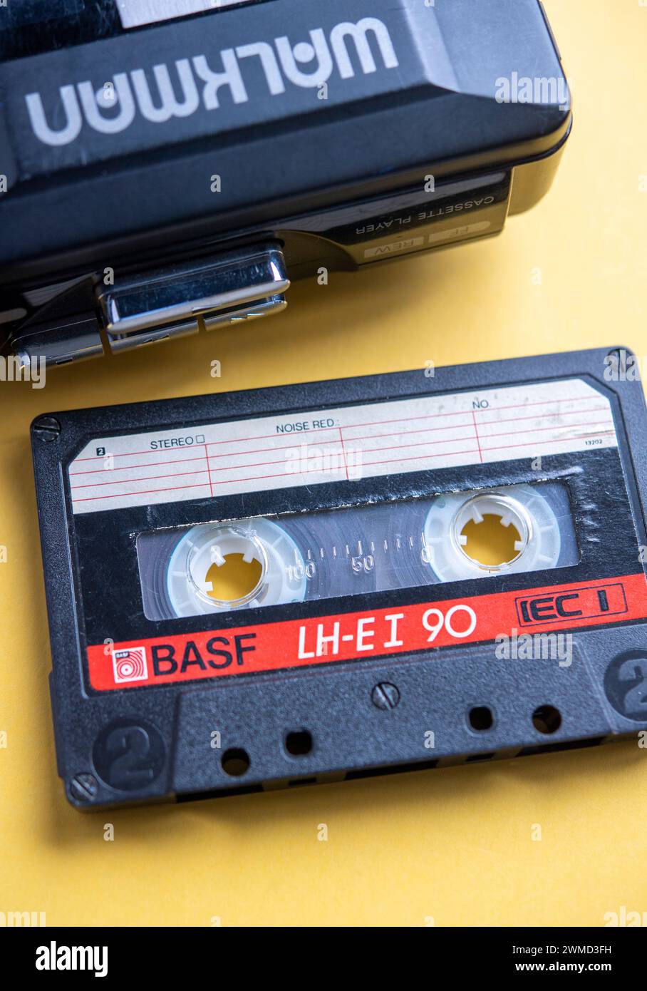 Still life of an audio cassette next to a 1980s Walkman Stock Photo - Alamy