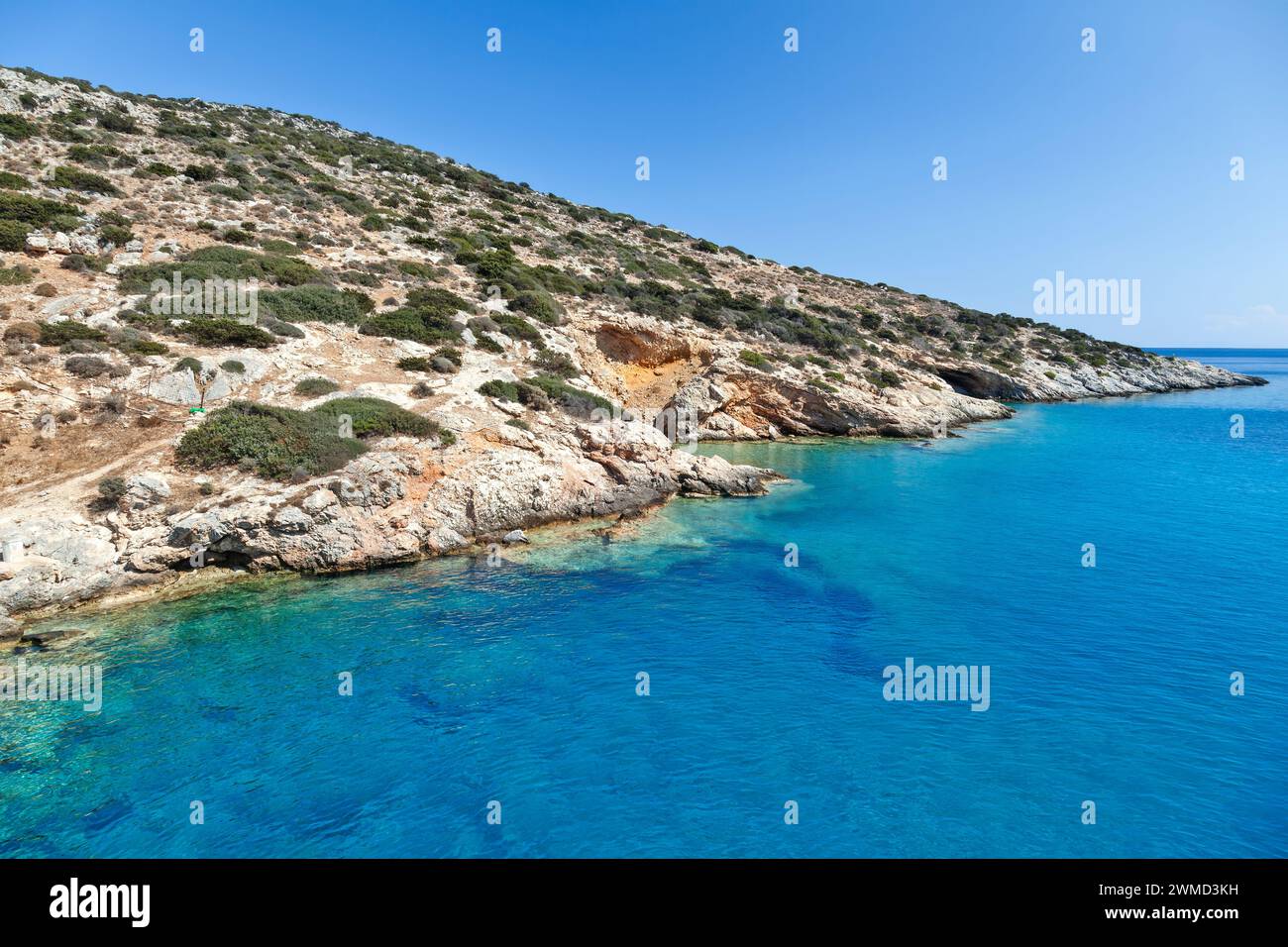 Rocky coastline in Schinoussa island, Greece, one of the Lesser Cyclades islands, close to Naxos, in Cyclades islands of the Aegean sea, Greece Stock Photo