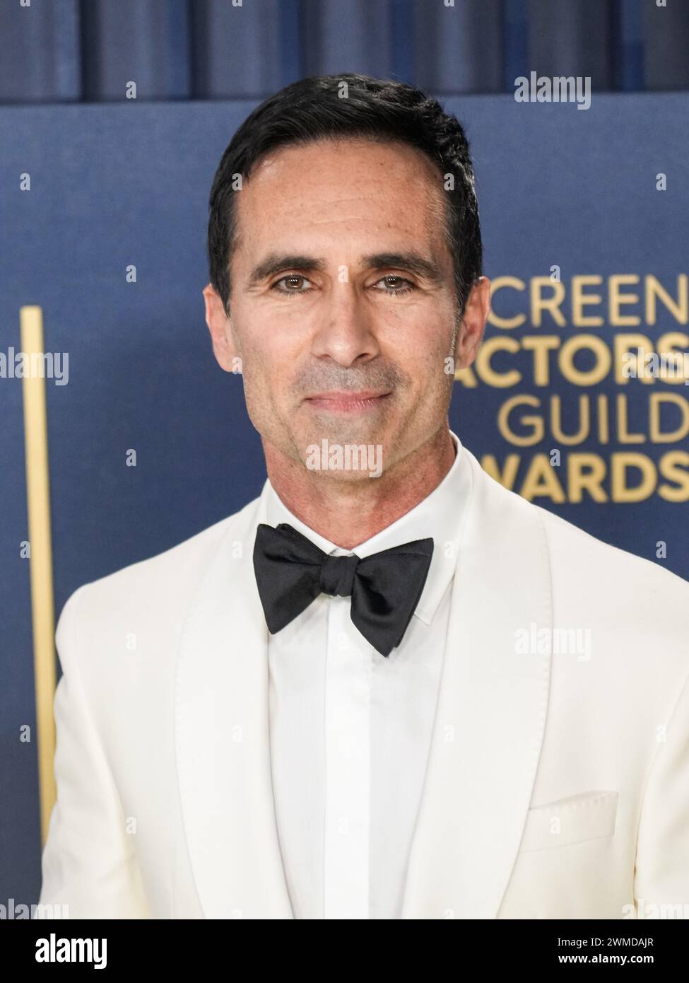 Los Angeles, USA. 24th Feb, 2024. Néstor Carbonell walking on the red