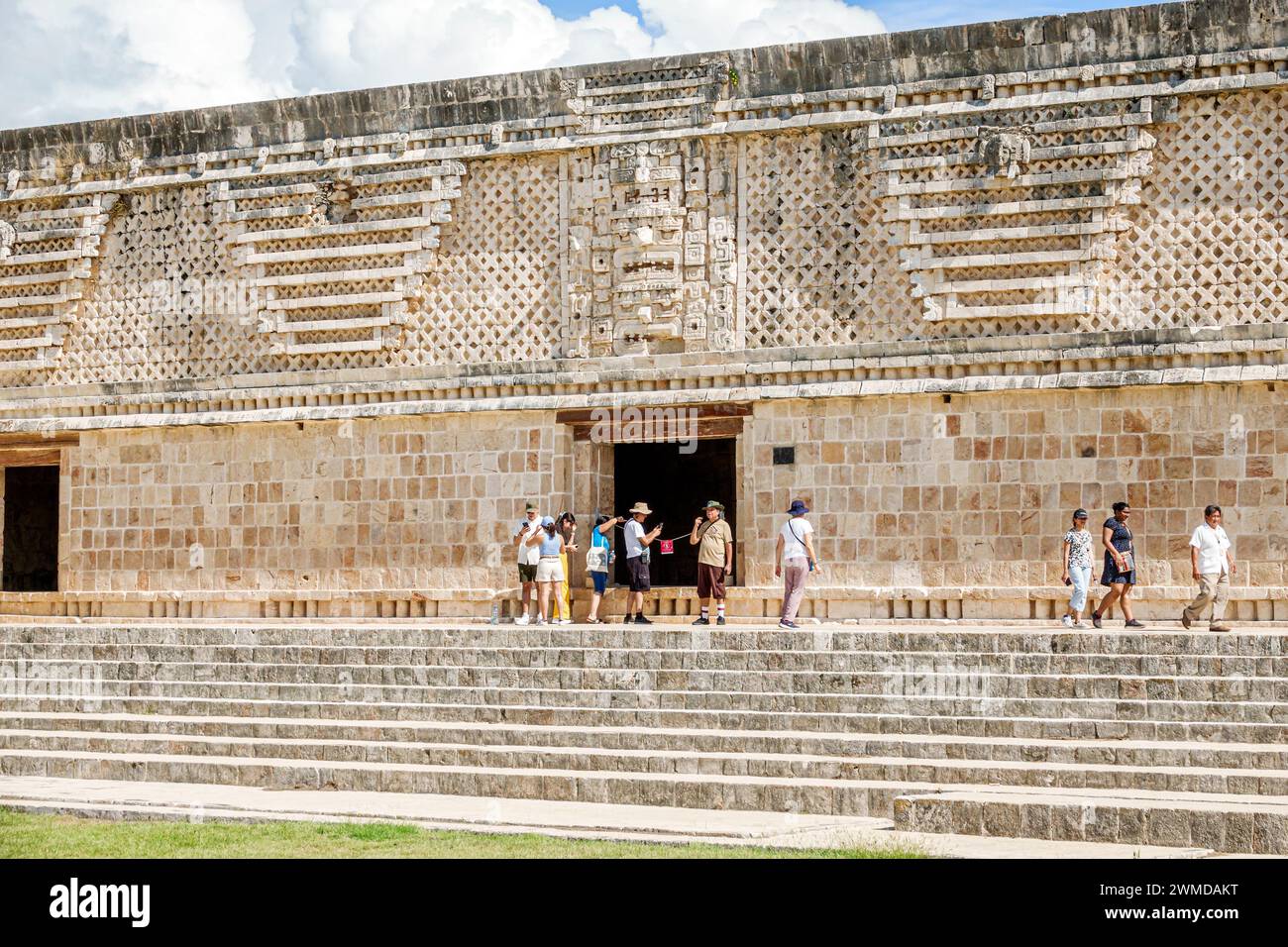 Merida Mexico,Puuc style Uxmal Archaeological Zone Site,Zona Arqueologica de Uxmal,classic Mayan city limestone,visitors man men male,woman women lady Stock Photo