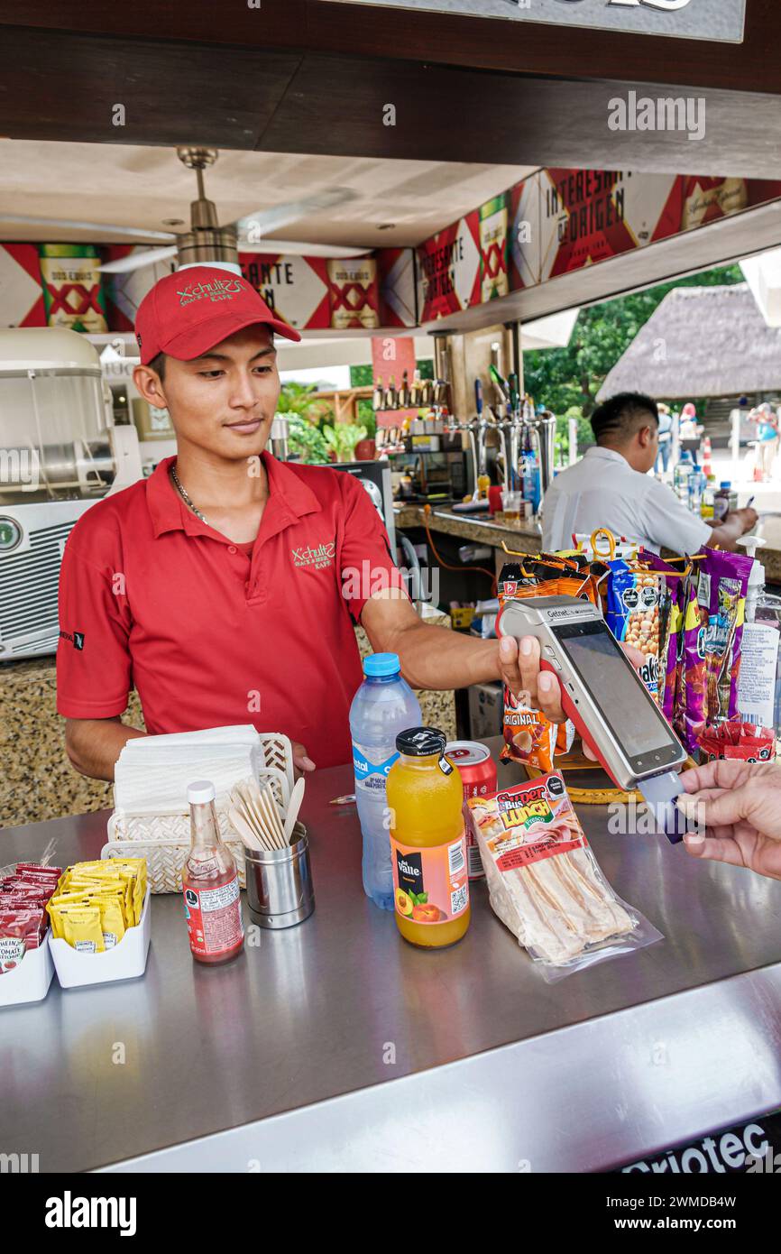 Merida Mexico,Uxmal snacks drinks vendor,offering ready-to-eat packaged sandwiches,holding credit card scanner,teen teenage teenager,adolescent teens Stock Photo