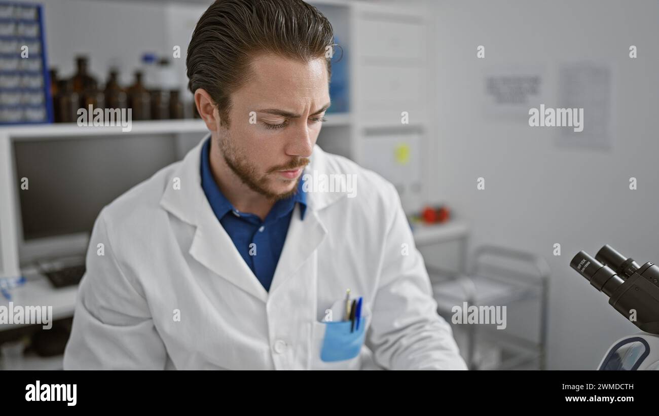 Male scientist sitting on chair hi-res stock photography and images - Alamy