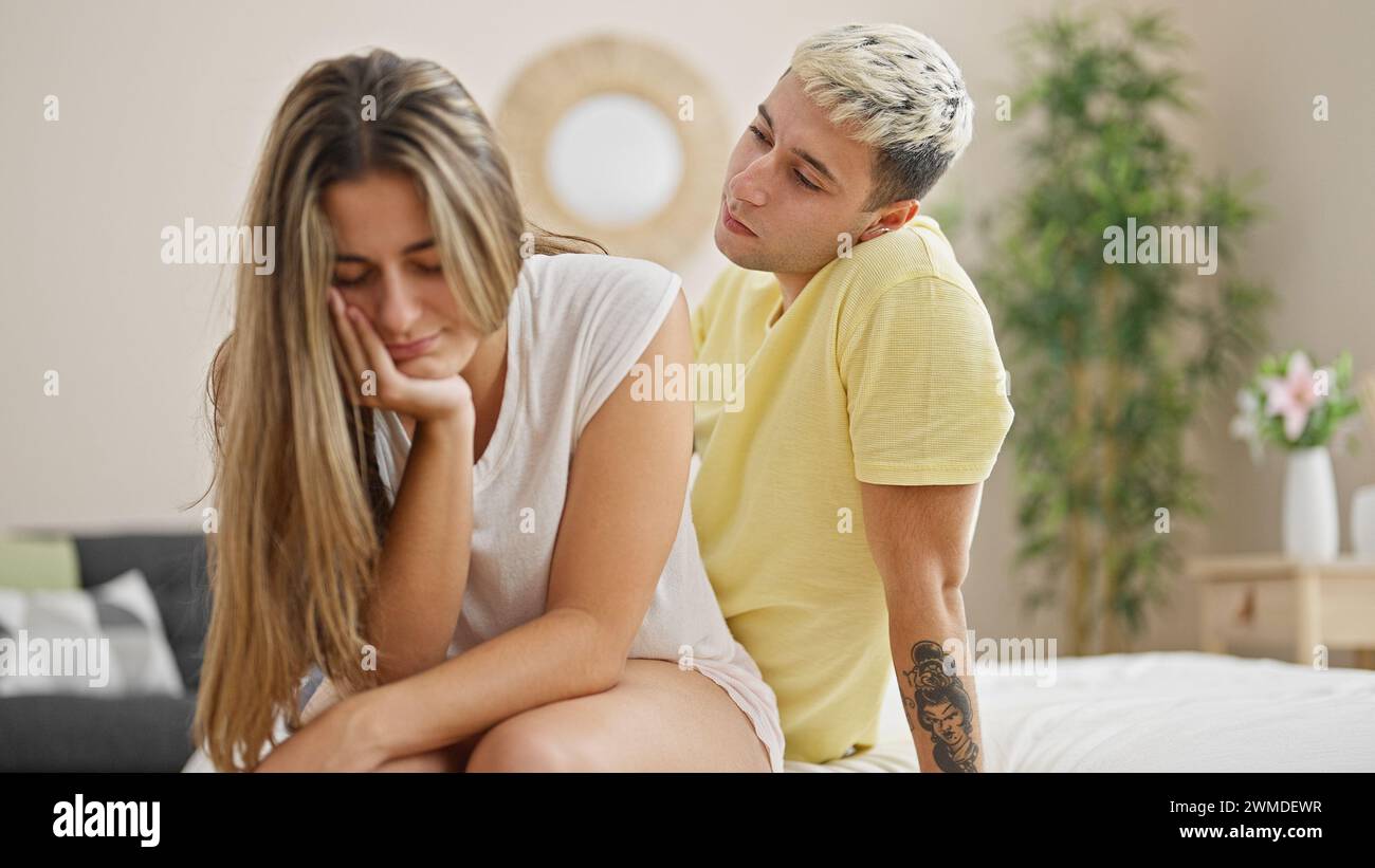 Woman man couple bed hug sad hi-res stock photography and images - Alamy