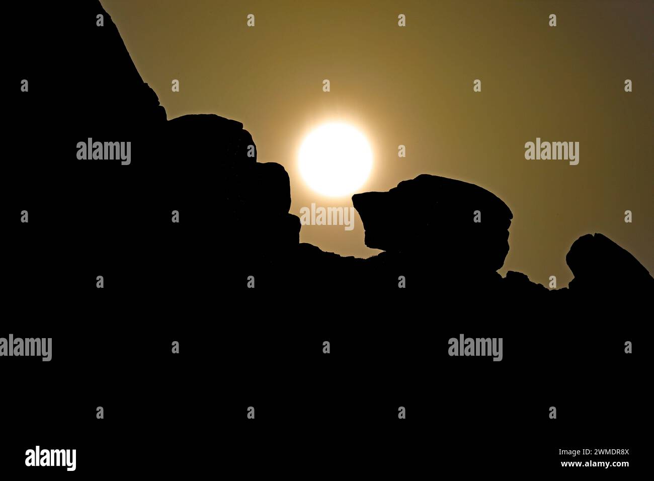 Silhouettes of Almscliffe Crag during sunrise near Harrogate,North Yorkshire,UK Stock Photo