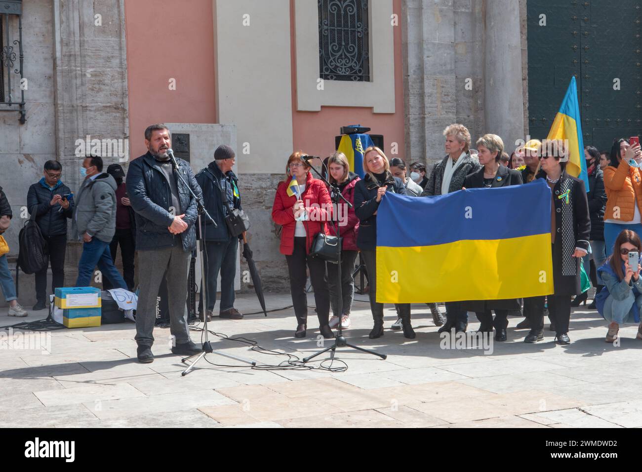 Spain, Valencia, March 27, 2022: Protest against the war in Ukraine and the invasion of Russia. People with flags at a demonstration in support of Ukr Stock Photo
