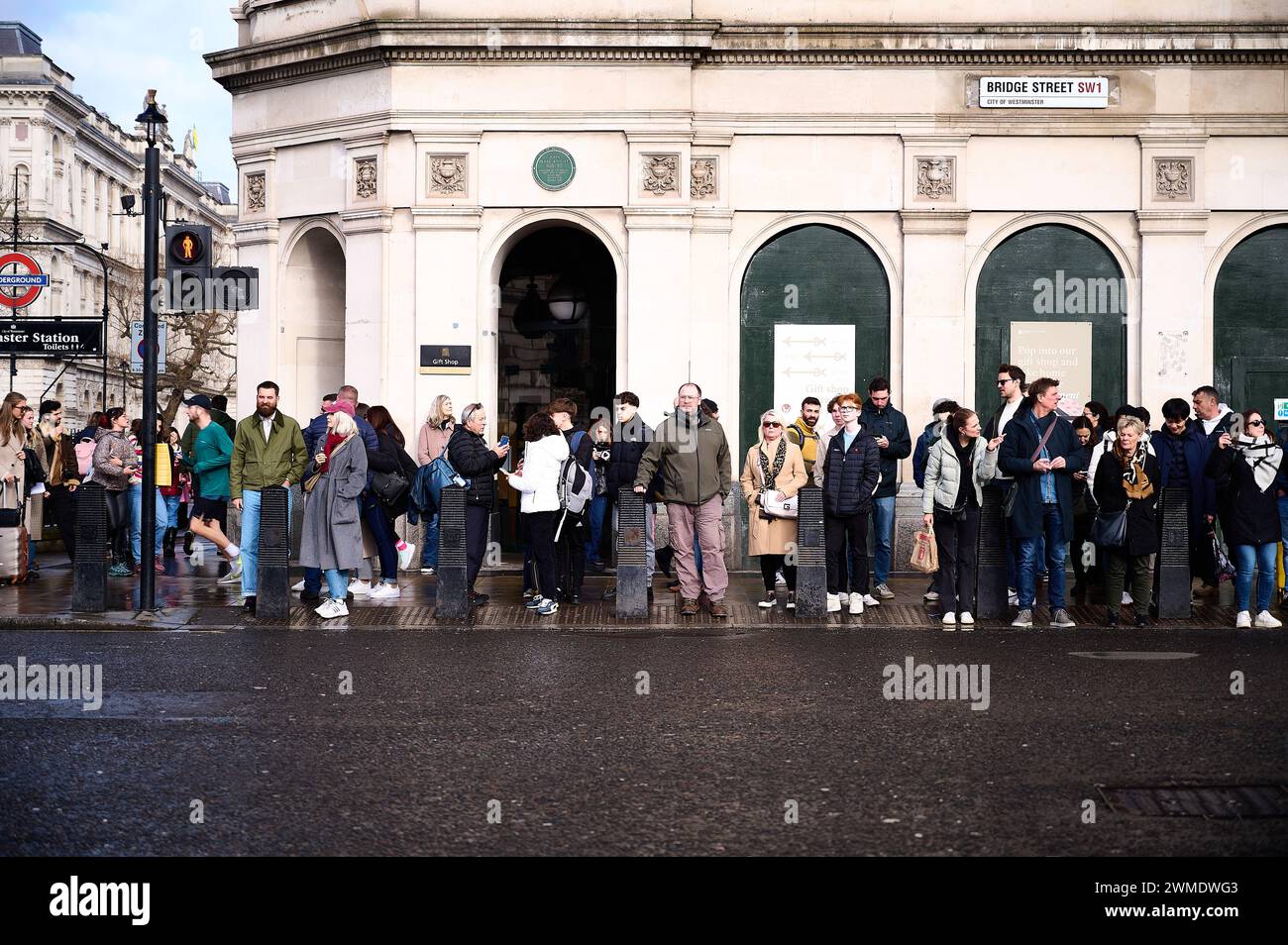 11 Feb 2024 - Londonuk : London street with people waiting to cross the road at pedestrian crossing Stock Photo