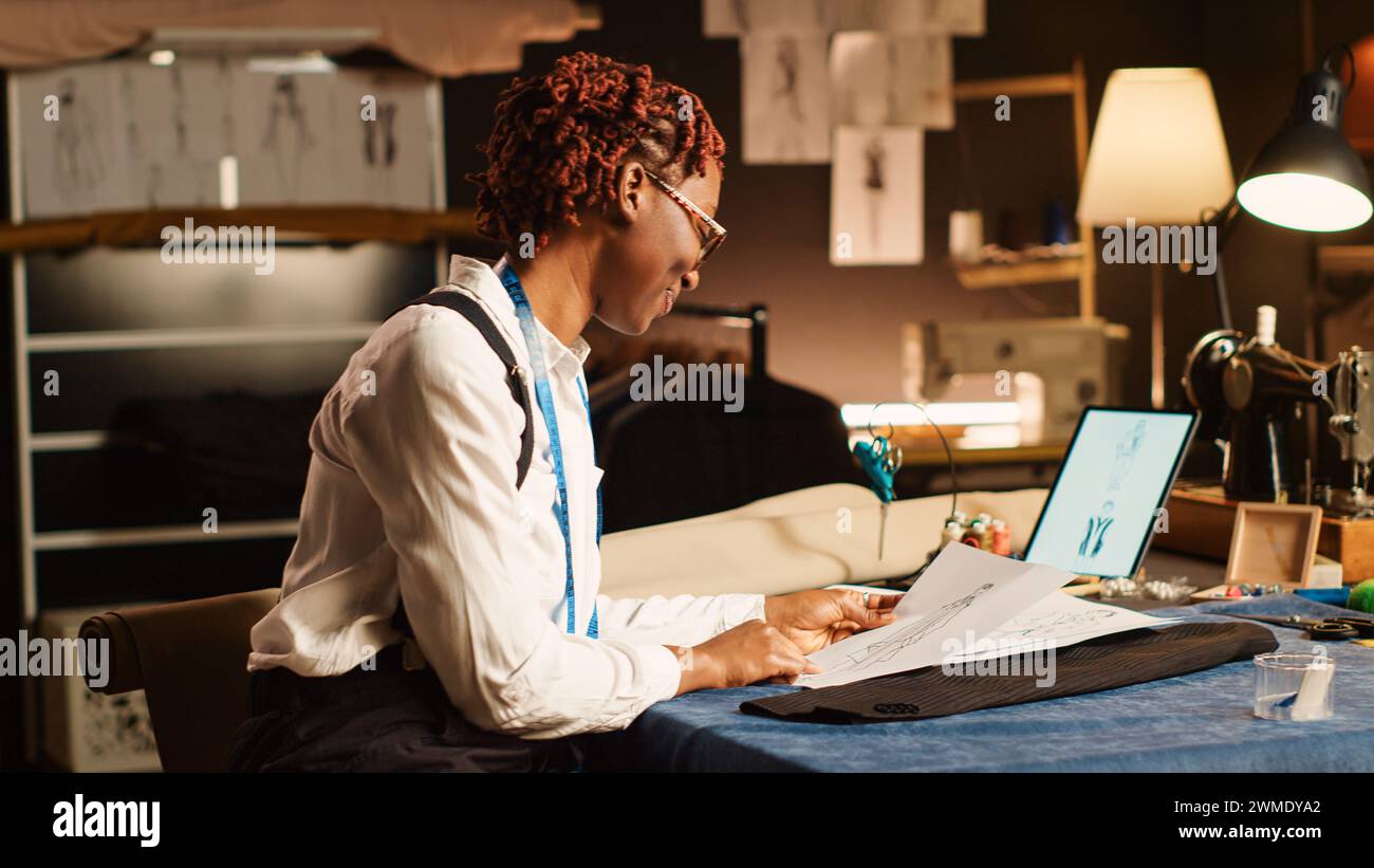 African american tailor reviewing sketch hi-res stock photography and ...