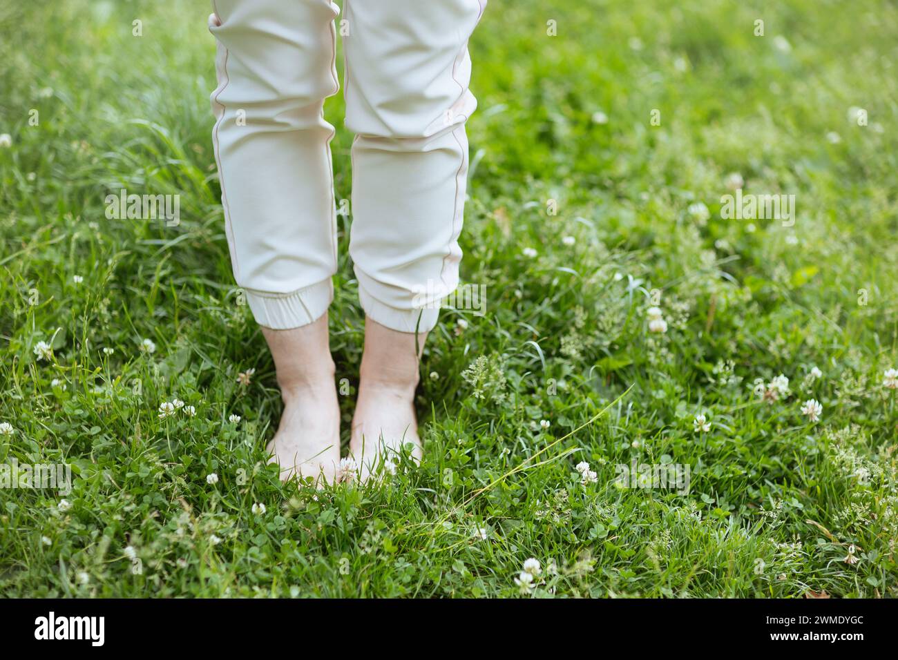 Summer time. Closeup on woman in the meadow outdoors. Stock Photo