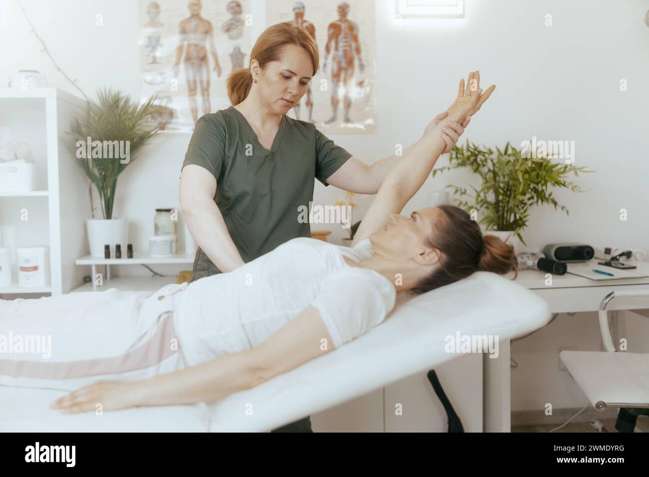 Healthcare time medical massage therapist hi-res stock photography and