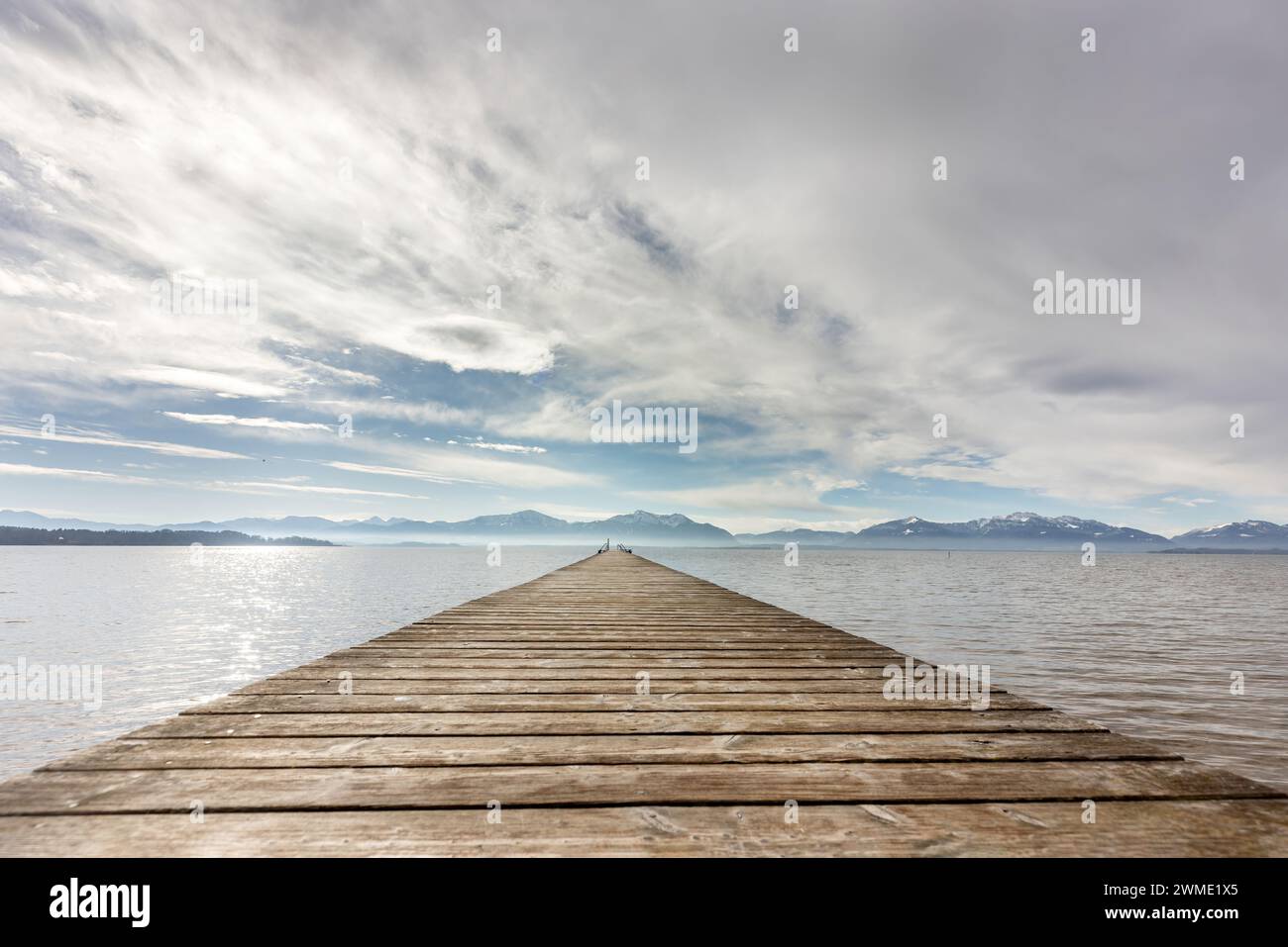 View at lake chiemsee, bavaria, germany, in late winter, february. Chiemgau alps are seen in the background Stock Photo