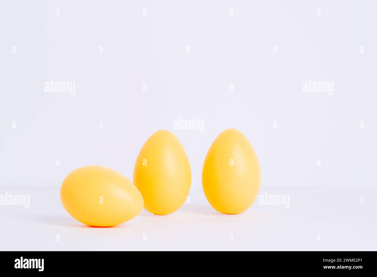 Three painted Easter eggs on white background. Easter holiday concept. Stock Photo