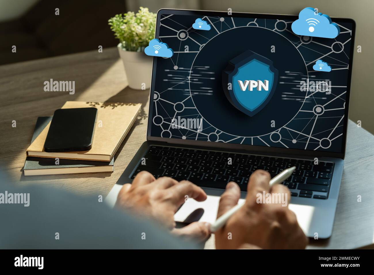 VPN Security Network with man using a laptop protection private network Stock Photo