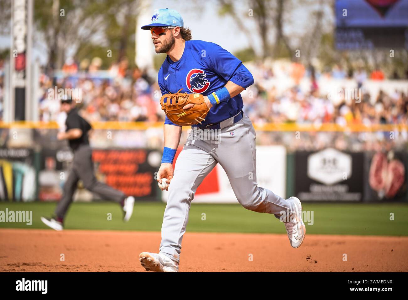 Chicago Cubs third baseman Patrick Wisdom (16) lobs the ball to first base in the fourth inning of an MLB spring training baseball game against the Sa Stock Photo