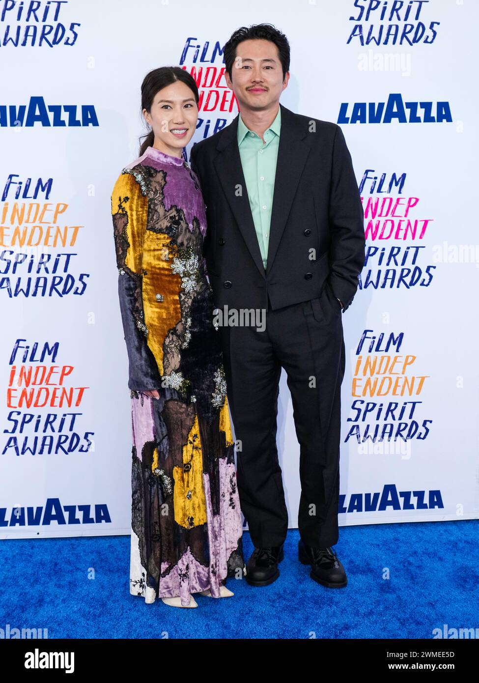 Los Angeles, USA. 25th Feb, 2024. Joana Pak and Steven Yeun walking on ...