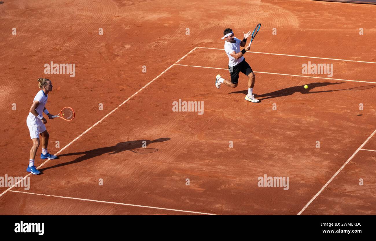 Rio De Janeiro, Brazil. 25th Feb, 2024. Nicolas Barrientos (R) of Colombia/Rafael Matos of Brazil compete during the men's doubles final between Lucas Miedler/Alexander Erler of Austria and Nicolas Barrientos of Colombia/Rafael Matos of Brazil at the 2024 ATP500 Rio Open at Jockey Club Brasileiro in Rio de Janeiro, Brazil, Feb. 25, 2024. Credit: Wang Tiancong/Xinhua/Alamy Live News Stock Photo