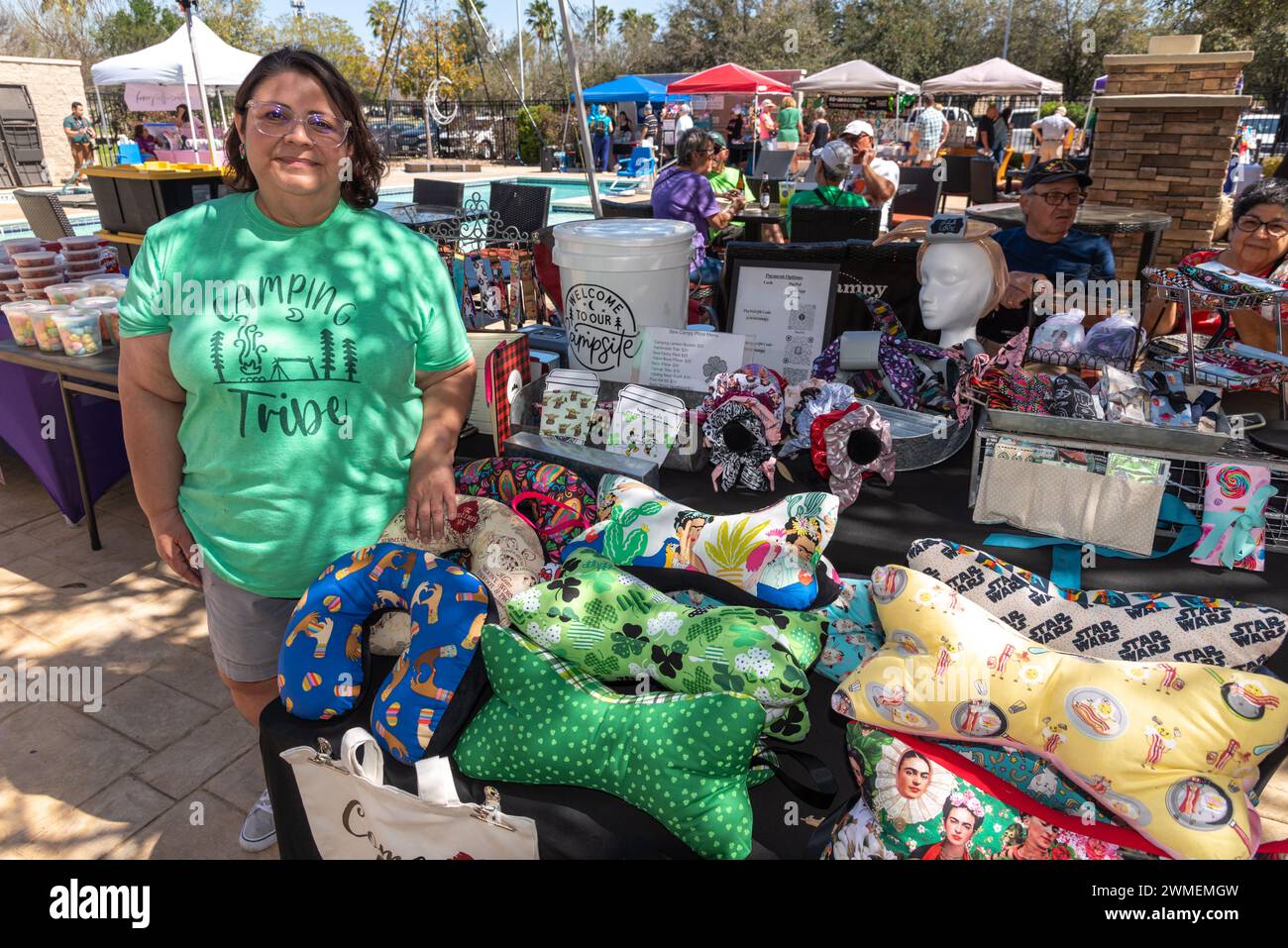 Small business owner Angela Vazquez stands by her vendor booth with one of a kind, hand sewn camping items and accessories, McAllen, Texas, USA. Stock Photo