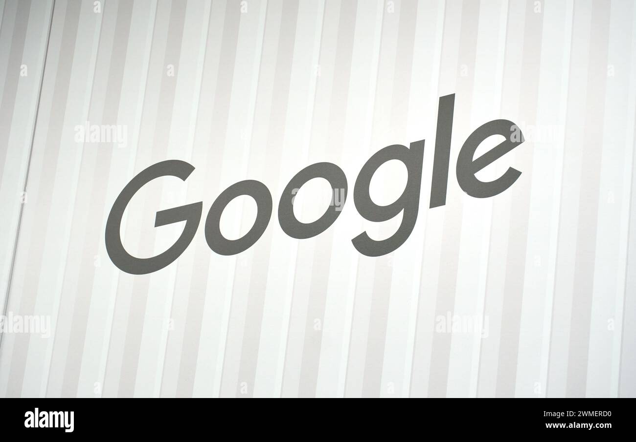 Dallas, TX USA - February 24, 2024: Google logo on a wall. Grey on white. Google, a US tech giant, is a leader in AI, advertising, search, cloud, soft Stock Photo