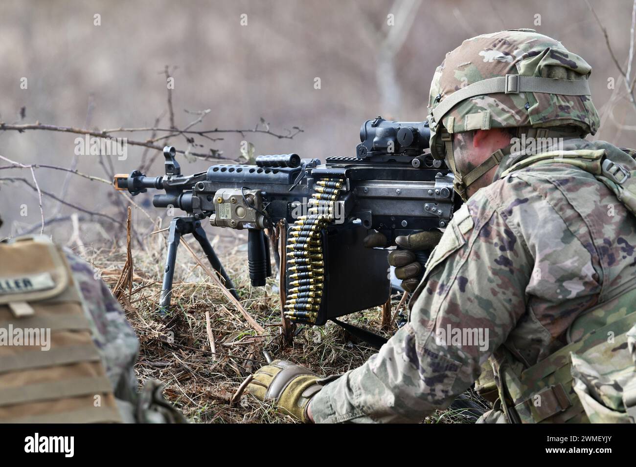 A U.S. Army Paratrooper assigned to the 1st Battalion, 503rd Infantry Regiment, 173rd Airborne Brigade, engages a target during team blank-fire and tactical movement training  as part of Eagle Ursa at the training range in Slunj, Croatia, Feb. 24, 2024. The 173rd Airborne Brigade is the U.S. Army's Contingency Response Force in Europe, providing rapidly deployable forces to the United States European, African, and Central Command areas of responsibility. Forward deployed across Italy and Germany, the brigade routinely trains alongside NATO allies and partners to build partnerships and strength Stock Photo