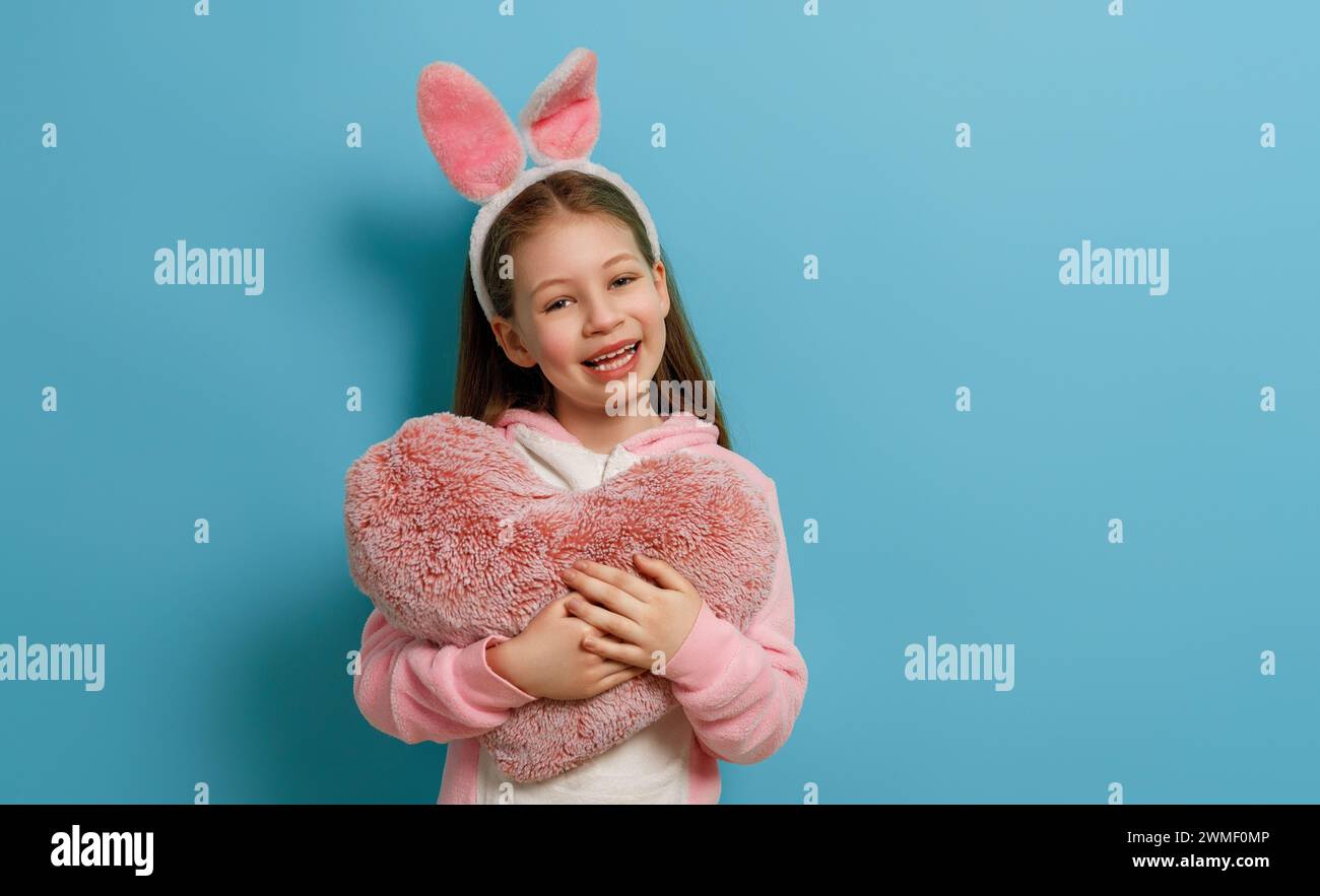 Cute little child wearing bunny ears on Easter day. Stock Photo