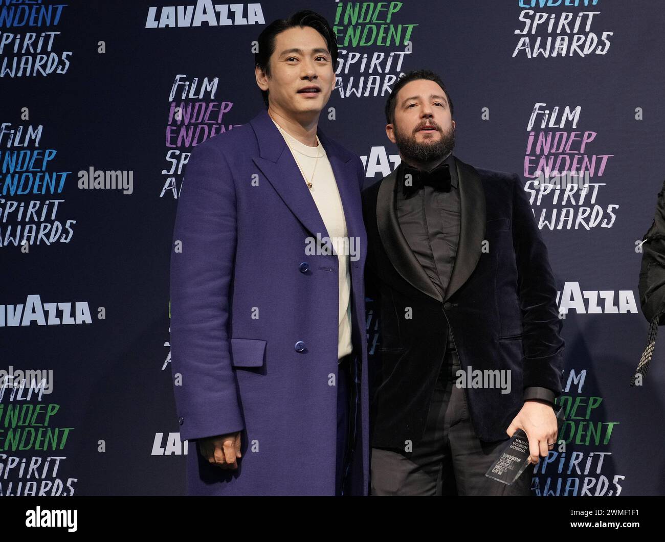 Los Angeles, USA. 25th Feb, 2024. (L-R) Teo Yoo and John Magaro winners of the Award for Best Feature for 'Past Lives' poses in the press room at the 2024 Film Independent Spirit Awards held at the Santa Monica Beach in Santa Monica, CA on Sunday, ?February 25, 2024. (Photo By Sthanlee B. Mirador/Sipa USA) Credit: Sipa USA/Alamy Live News Stock Photo