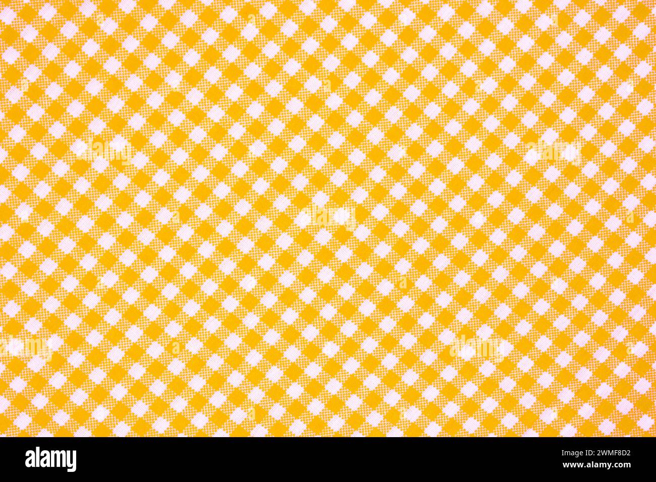 Striped and plaid yellow fabric pattern. Plaid background pattern texture. Stock Photo